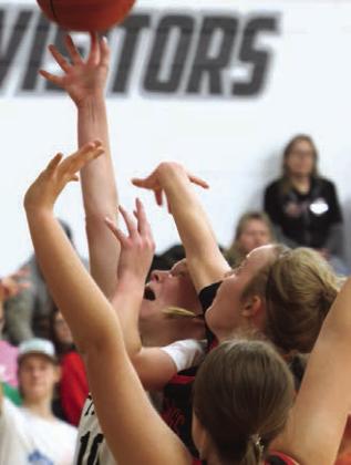 Easton Larson forces her shot past the Mustang's defense.