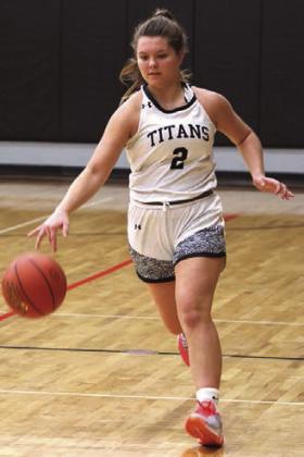 Brooke Gullickson brings the ball up the court.