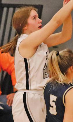 Kiara Aasand goes up for a three point attempt Monday afternoon against North Border in Drayton. VNV Photo by Lesa Van Camp