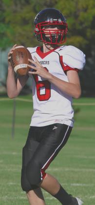 Freshman Jonah Rarick looks for an open Bomber late in the game against Warwick. Photo by Lyle Van Camp
