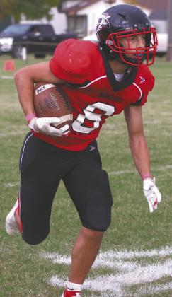 Carter Johnson picks up some yards for the Bombers. Photo by Lyle Van Camp