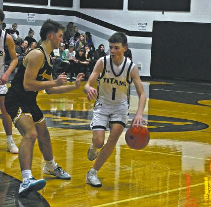 DVE Senior Drew Passa moves the ball down the court. Photo by Jamie Rarick