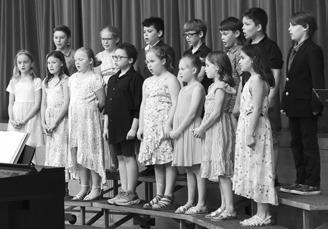 The third graders performing their songs. Photo by Lyle Van Camp.
