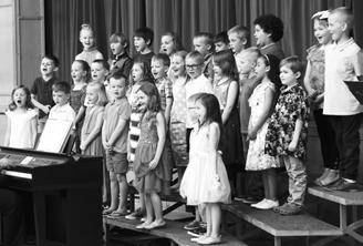 Pre-K and first graders bring great energy to their performance. Photo by Lyle Van Camp.