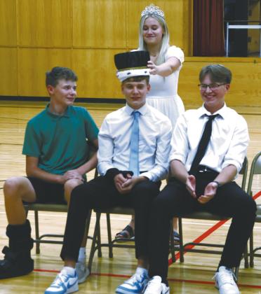 2023-2024 Homecoming Queen Claire Thompson crowns Quinn Passa 2024-2025 Homecoming King. Also pictured are Drew Passa and JJ Knutson. Photo by Lyle Van Camp