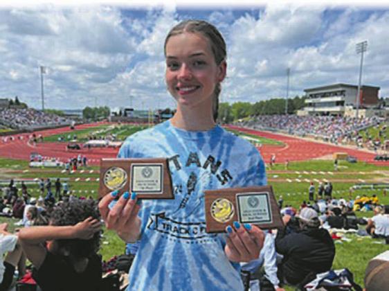 Elizabeth Fedji crushed the 24 year DPS standing record in the 400 dash. Photo by Jeryl Thompson