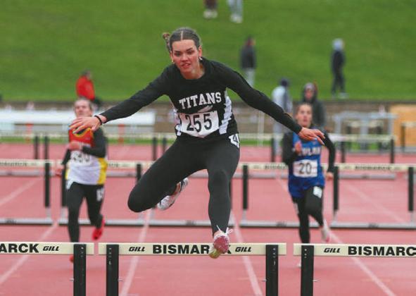 Elizabeth Fedji placed 2nd in 300 hurdles. Photo by Mike Steinfeldt