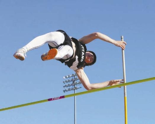 Grant Vold dominated the pole vault height of 10’6” Photo by Larry Stokke.