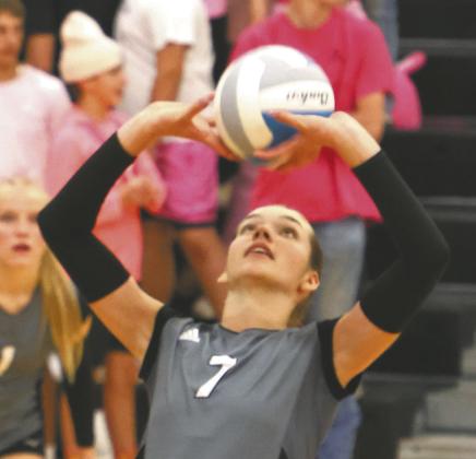 Elizabeth Fedje puts up a set in action against May-Port_CG. Photo by Lyle Van Camp