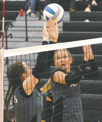 Elizabeth Fedje and Easton Larson go up for a block attempt in Drayton last week. Photo by Lyle Van Camp