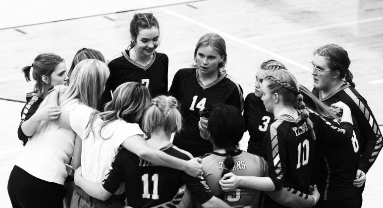 The Titans and coaches Jodi Fedje and Sara Gullickson huddle up between sets in their match Sept. 27 vs. Park River.
