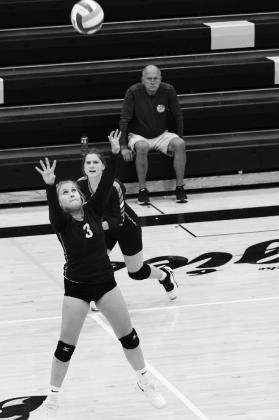 Junior Claire Thompson sets the ball vs. Park River. Thompson finished with 3 assists in the 3-0 loss to the Aggies.