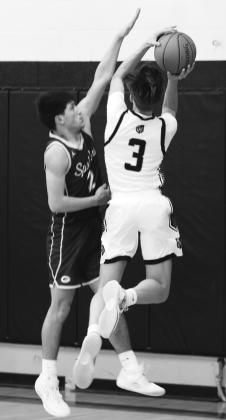 Calvin Otto tries to shoot over Grafton's Tony Villarreal. Photo by Lyle Van Camp.