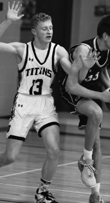 Connor Hurtt gets tied up with Grafton's Kyler Droog. Photo by Lyle Van Camp.