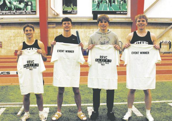 Members of the 4x300 relay team: Carter Johnson, Brady Reilly, Sam Kittelson, and Carter Oberg pose with their t-shirts awarded to all event winners. The team finished 1st with a new school record of 2:36.56. Photo by Jamie Rarick