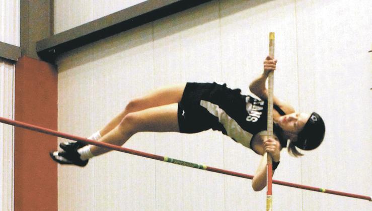 DVE pole vaulter Alyssa Hoyles clears the bar at 10' 6', winning the event and setting new records for both the school and the meet. Photo by Jamie Rarick