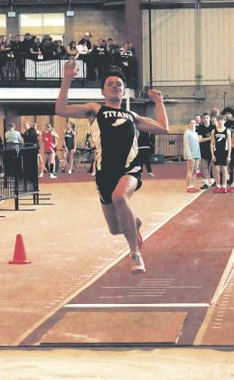 DVE senior Brady Reilly launches forward during the boys long jump competition. Reilly set a personal record at 17' 9' and finishing 6th for the event. Photo by Jamie Rarick