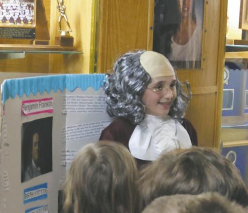 Fifth grader Austyn Stangeland shared her presentation on founding father Benjamin Franklin with a group from the first grade class. Photo by Jamie Rarick