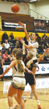 DVE senior Elizabeth Fedje gets the shot off over Cavalier defender Nevaeh Schroeder. Photo by Jamie Rarick