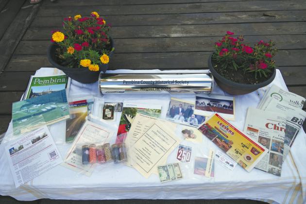 Items to be sealed inside the time capsule to be opened in 50 years. Photo by Larry Stokke