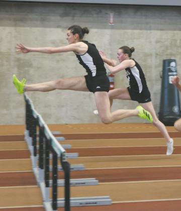 DVE's Elizabeth Fedje pulls ahead of teammate Jocelyn Vold and Langdon Area's Meggy Hetletved to win the Women's 60m Hurdles with a personal best of 9.84. Vold was a close second with a personal best of 10.05. Photo by Jamie Rarick