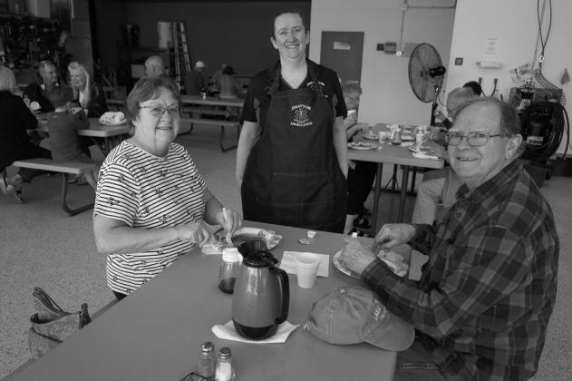 Betty and Daniel Pelletier chat with squad member and daughter Amber Green. Submitted photo.