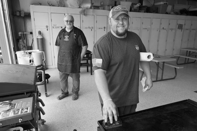 Bill Tuttle and Jordan Grundstrom man the grills. Submitted photo.