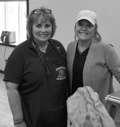 Cindy Collette and Kayla Thompson take a quick break in the kitchen. Submitted photo.