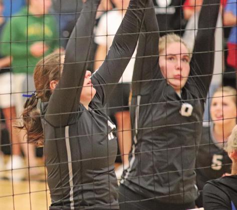 Maddison Hermanson (left) and Kiera Aassand (right) block the ball from the Hatton Northwood Thunder in Drayton. VNV Photo by Lesa Van Camp