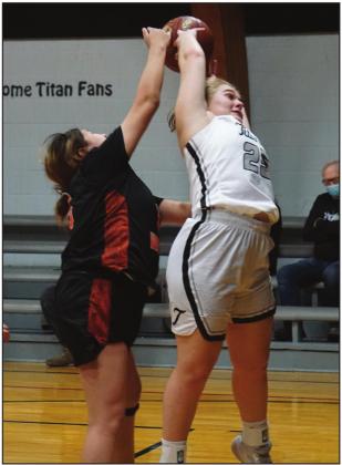 Ella Kittelson fights for a rebound against a Warrior defender. VNV Photo by Lyle Van Camp