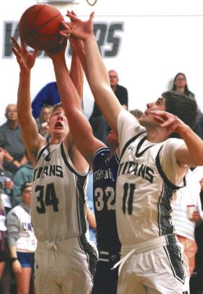 Evan Feltman and Jack Langerud fight a Hatton-Northwood player for control of the ball.