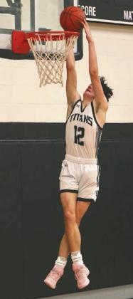 Everett Fedje puts down a dunk against Hatton-Northwood.