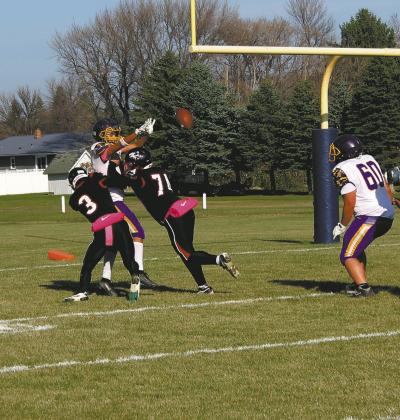 Trenten Keena and Praise Chairez take down the Eagles quarterback, resulting in an incomplete pass. Photo by Jamie Rarick.