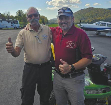 James Owen (right) with Dave Garris, airport manager at Johnson County Airport, one of the distribution points he delivered to. “Garris worked from sun up until sun down unloading planes,” said Owen. Photo contributed by Owen.
