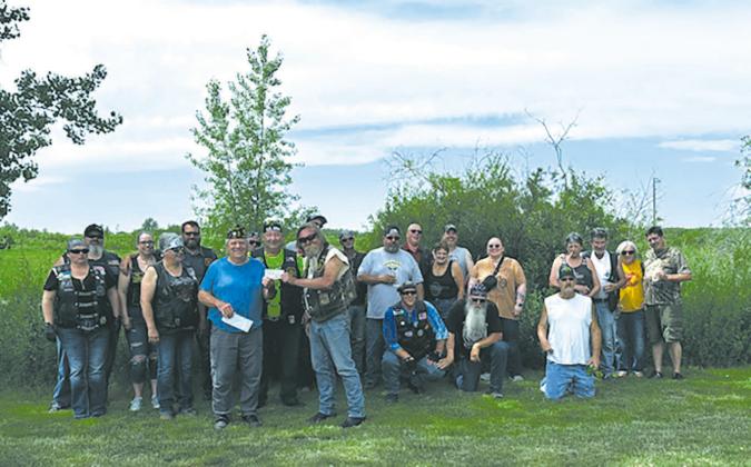 American Legion Riders of Kern-Thompson Post 77 Pembina sponsored a Fun-Run recently. The group stopped by the Karlstad American Post 445 for a break from the heat and delicious picnic lunch provided by the Karlstad American Legion Auxiliary. The Pembina American Legion Riders raise funds for The Special Olympics and local benefits held in their community. Post 445 Past Commander Wayne Krantz, presented them a check for $500.