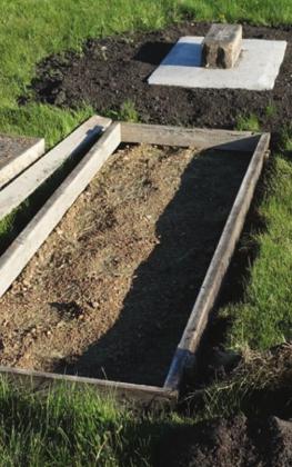 A family plot with the markers removed and the form in place for new concrete. VNV Photo by Lyle Van Camp