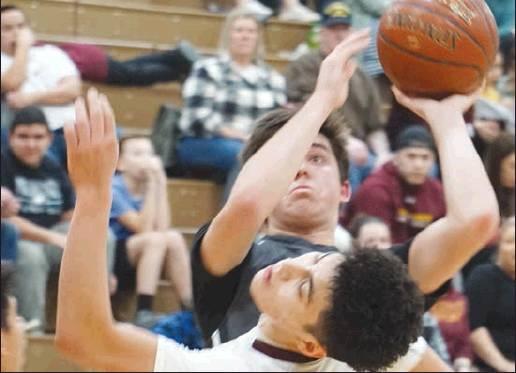 Tyson Backer forces a shot past Grafton’s Justin Garza. VNV Photo by Lyle Van Camp
