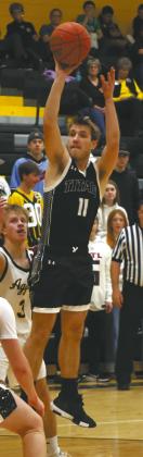 DVE senior Isaac Feltman goes airborne for the shot in Park River Jan. 6. Photo by Jamie Rarick
