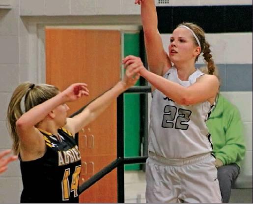 Kasey Stegman takes a shot while Peyton Schroeder defends against her. Photo submitted by Kerri Stegman, Drayton Public School
