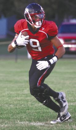 Mason Pollestad looks up the field for an opening. Photo by Lyle Van Camp