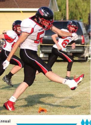 Grant Vold kicks off after a Bombers score late in the game. Photo by Lyle Van Camp.