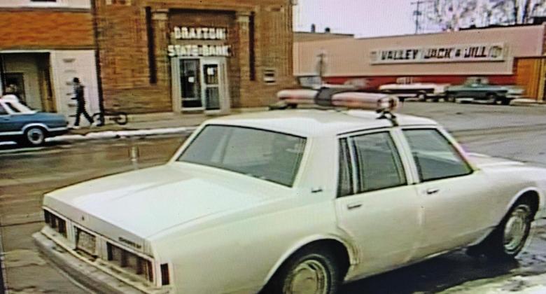 A police car is parked across from Drayton State Bank after it was robbed on Feb. 19. 1987. Contributed / State Historical Society of North Dakota