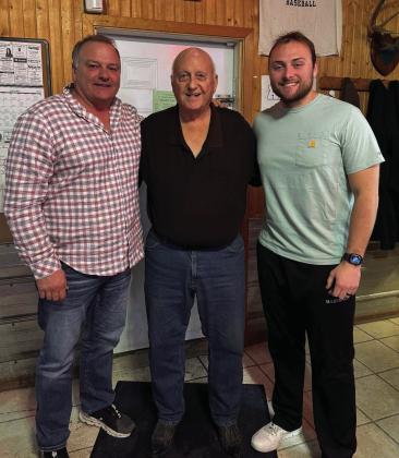 Dennis Barker (middle) with his son-in-law Brent Baldwin (left) and grandson Hunter Baldwin (right) have served the St. Thomas Booster Club for three generations. On Saturday, the trio will be frying fish for a good cause.