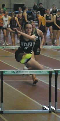 DVE freshman Jocelyn Vold leaps over the hurdle in the Girls 60 M Hurdles. Vold earned a place in the finals, placing 7th overall and setting a new personal record. Photo by Jamie Rarick