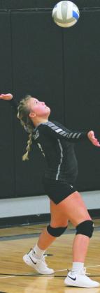 Junior Claire Thompson serves the ball vs. Grafton. Thompson had one service ace in the 3-0 loss to the Spoilers.