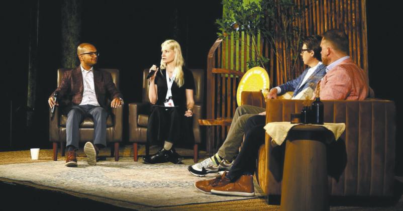 Suhas Narayanaswamy of Lewis and Clark AgriFood (left) in discussion with moderator Jennifer Marston of Ag Funder at a panel on innovations that will impact agribusiness in the future hosted by Bushel in Fargo in June. Patrick Honcoop (right), CEO of Ag-Tech Pro, and Jake Joraanstad (far right) listen in.