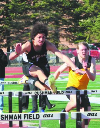 Pulling ahead as he cleared the hurdle, Mason Pollestad won the Men’s 110 Hurdles with close competition and a finish of 15.49. Photo by Jamie Rarick