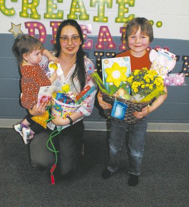 Drayton High School English Teacher Mariia Podvolotska and family were the lucky winners of a gift basket at family night. Photo by Jamie Rarick