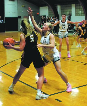 Titan senior Reese Fering puts up strong defense against Aggies senior Madison Bernhoft. Photo by Jamie Rarick