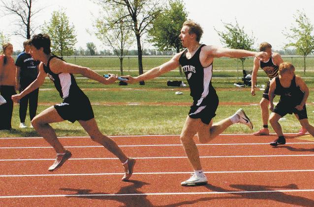 Carter Oberg passes the baton to Brady Reilly in the boys 4x200 relay. Along with teammates Carter Johnson and Jack Langerud, they won the regional championship and set a new North East Region meet record with a time of 1:33.92. Photo by Jamie Rarick